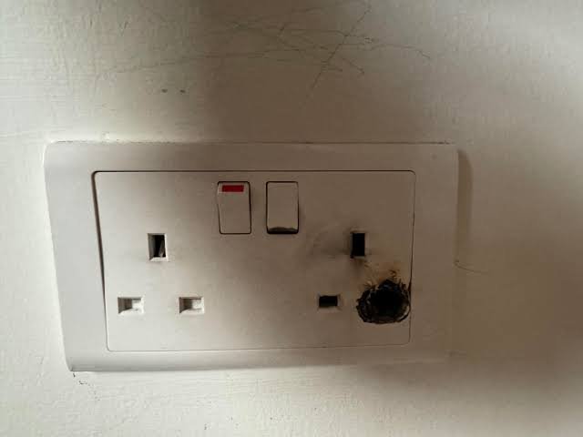 Burning Smells & Sparks electrician at work